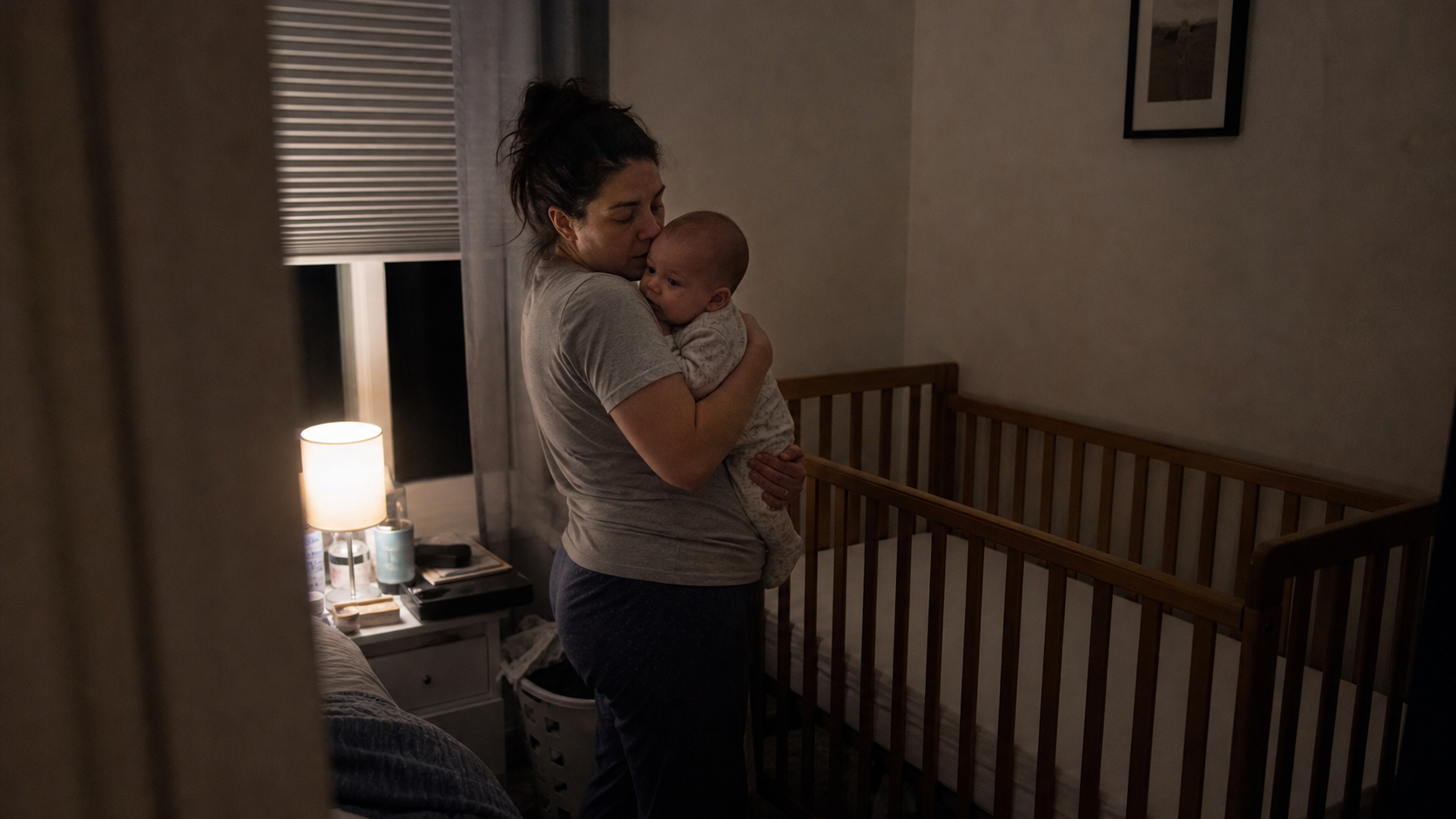 A softly lit nursery at night, calm and uncluttered, ready for sleep