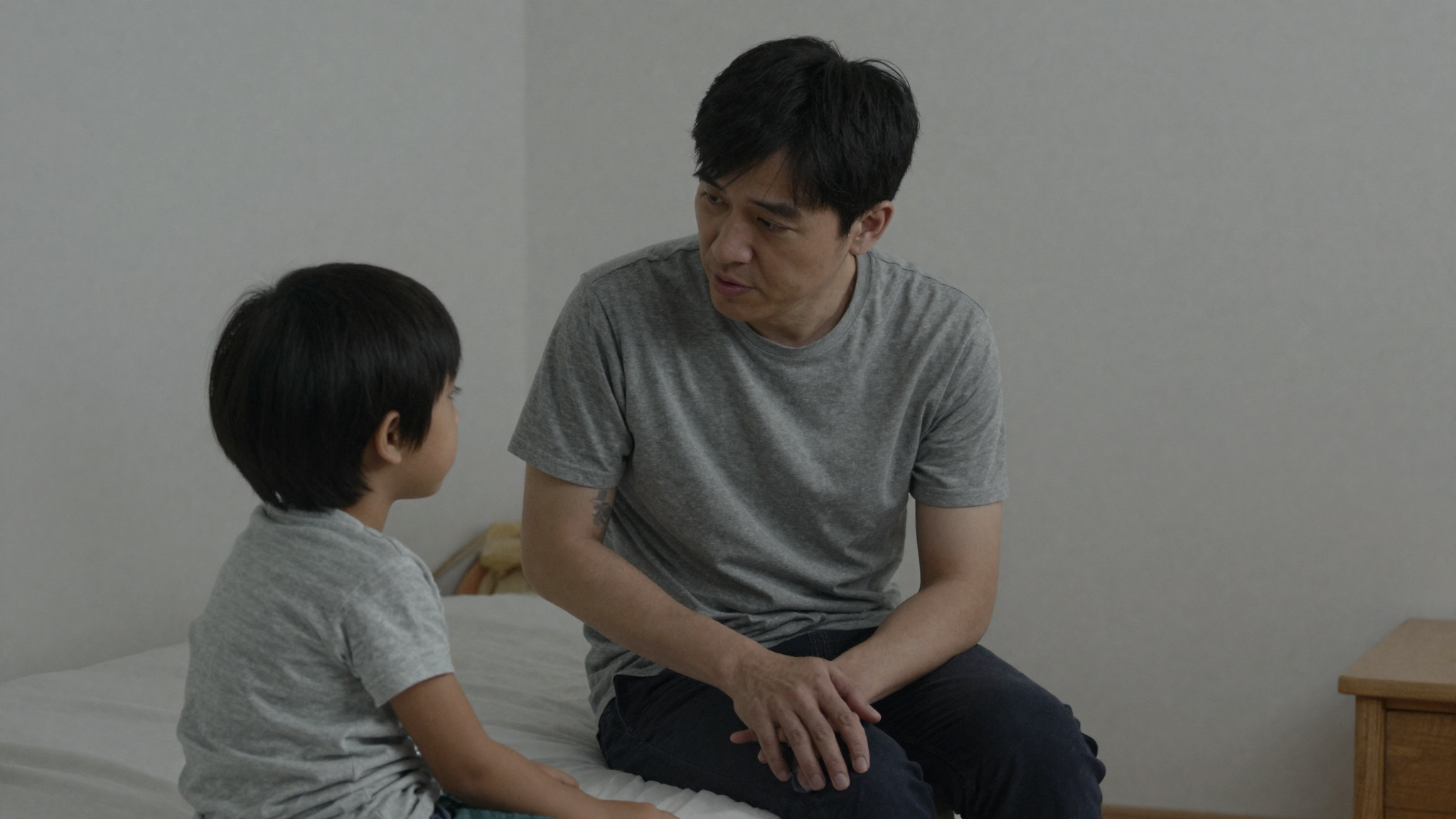 Parent talking gently with a child about separation in soft evening light